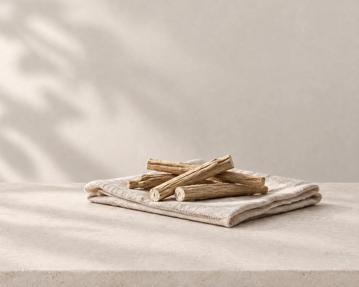 Dried ashwagandha root on a linen cloth